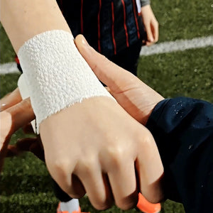 White textured athletic wristband on players arm in Football Matchday Kit