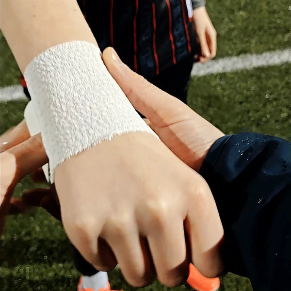 White textured athletic wristband on players arm in Football Matchday Kit