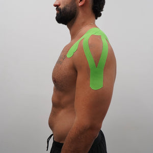 Bright green K-Tape in V-shape on shoulder and upper back