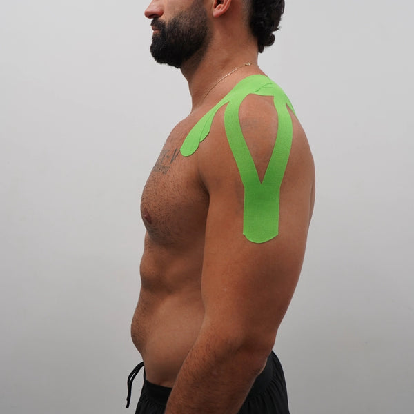 Bright green K-Tape in V-shape on shoulder and upper back
